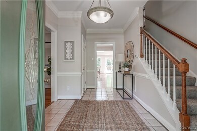 A bright and open foyer welcomes guests.  Classic