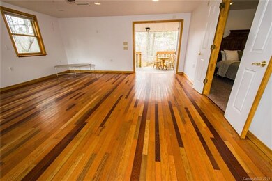 Family room with hardwoods and access to nature.