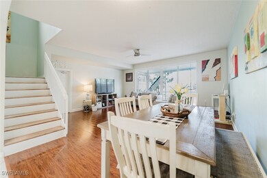 Dining area featuring stairs, wood finished floors