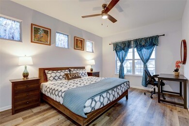 Bedroom with light wood-style flooring, baseboard