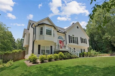 Bi-level home featuring a chimney and roof with shingles