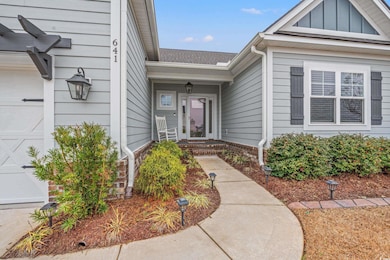 Entrance to property with a garage