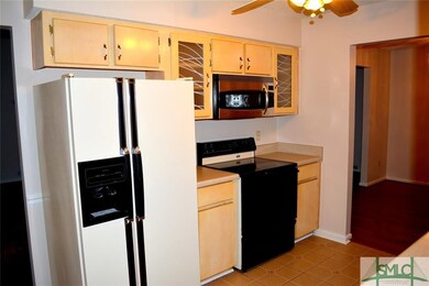 Kitchen with Refrigerator, Stove, Microwave