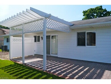 Private stamp concrete patio and slider leading to the kitchen