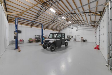 Inside shop. Car lift remains