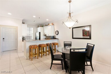 Dining space with ornamental molding, baseboards,