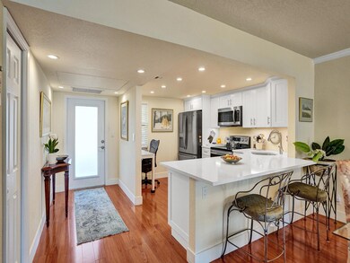 View to front foyer and kitchen