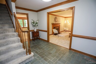 Slate Tile Formal Entry with Chair and Crown Mould