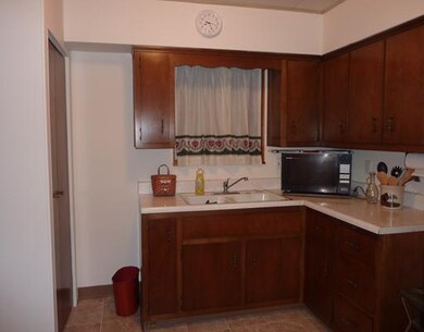 Kitchen. The cheery kitchen has been freshly carpe