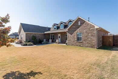 View of front facade with a patio and a front yard