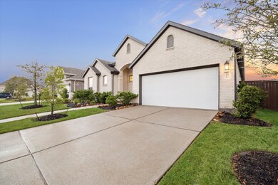 Double wide driveway, with 2 Car Garage features a