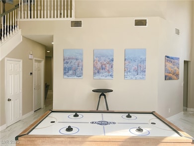 Playroom featuring marble finish flooring and base