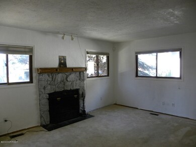 Living area with wood burning fireplace