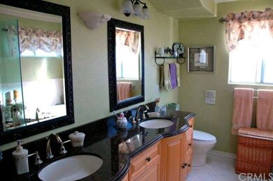 Master bathroom with granite top vanity and double