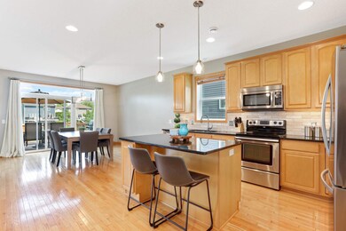 This open layout connects the kitchen to a charming dining area, perfect for entertaining guests. Large glass doors lead to a delightful deck outside creating an effortless indoor-outdoor flow.