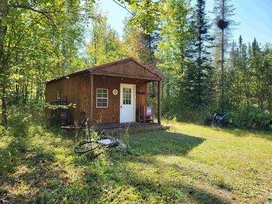 View of outbuilding featuring a yard