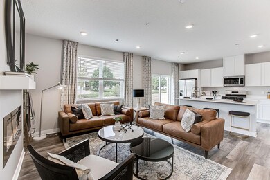 The rest of the main level pours out from the kitchen space, which flows straight into an open-concept styled living and dining area! Image is of model, colors may vary.