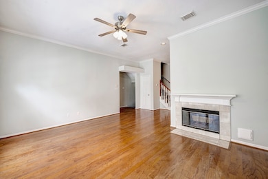 The second-floor living space features wood floors