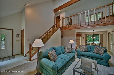 Main open living w/ cathedral ceiling
