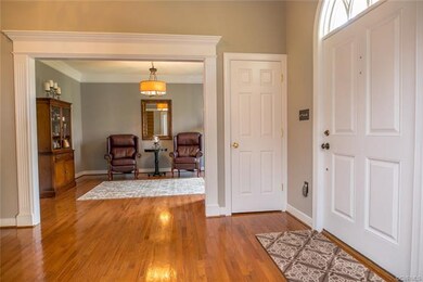 The two story foyer is flanked on either side by t