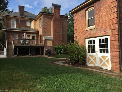 Large rear deck overlooking private back yard and carriage house at right (man cave upstairs).