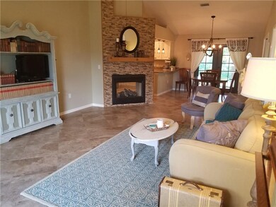 The two sided fireplace opens from the great room 