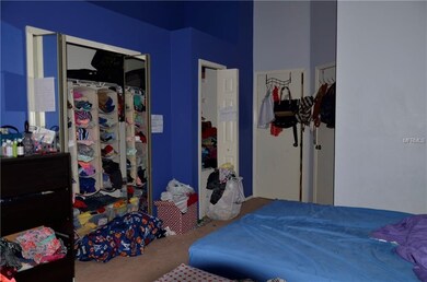 master bedroom and wall of closets
