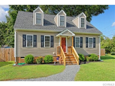 This home's symmetrical exterior and adorable curb