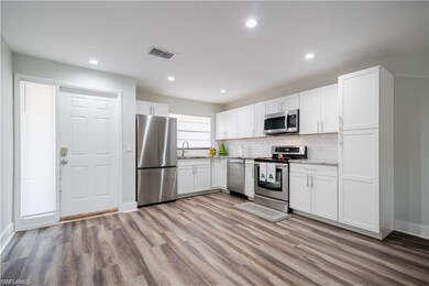 Kitchen featuring stainless steel appliances, hard