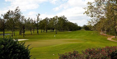 View of property's community with a yard