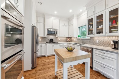 Open kitchen with marble countertops and Jennair a