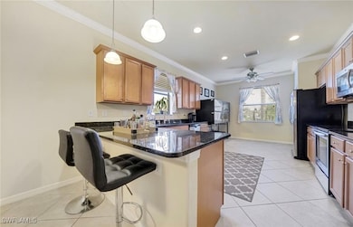 Kitchen with stainless steel appliances, light til