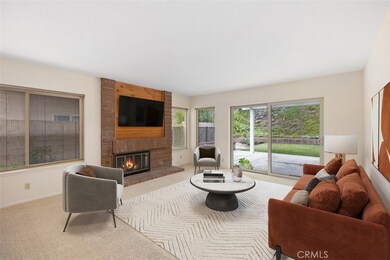 Large family room with fireplace.
Note: This room is virtually stagged.