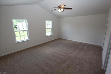 Bright vaulted master! Ceiling fan not included. Home under construction is similar to one in photo.