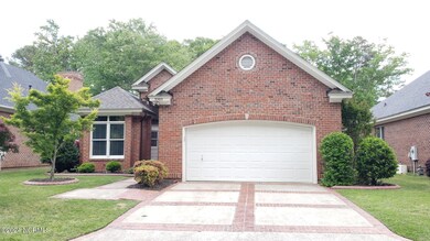 DOUBLE DRIVEWAY WITH BRICK ACCENTS!