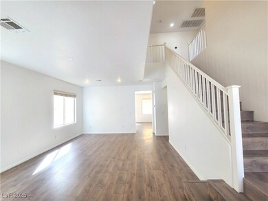 Unfurnished living room featuring visible vents, s
