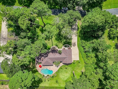 Aerial perspective captures the entire backyard re