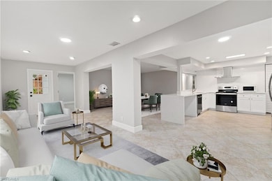 Living room featuring sink and light tile patterne
