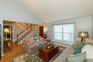 Cathedral Ceiling living room in front of house.