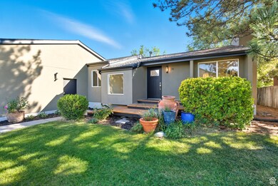 Stucco home with wooden deck
