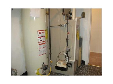 Other. Furnace.  Hot water tank.  New vinyl floor.