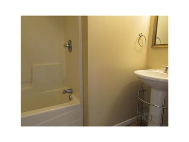 Bathroom. Bath with ceramic tile floor and new pai