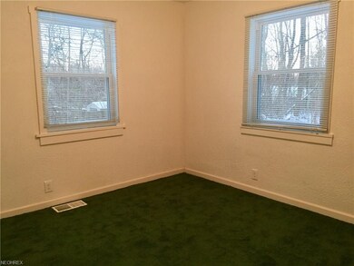Cute bedroom with new carpet. Walls are white, but