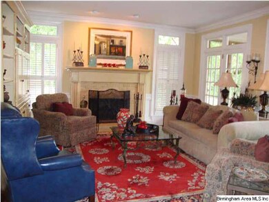 Cozy den opens to the kitchen and screened porch -