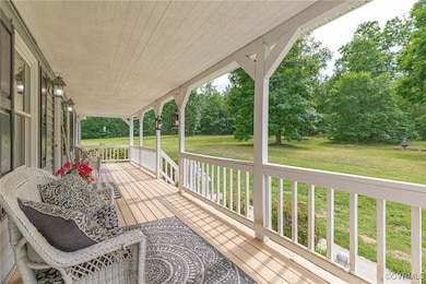 Wooden porch with a yard