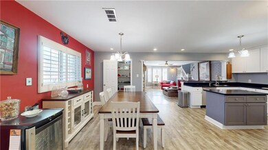 Dining area opens to Kitchen and Den
