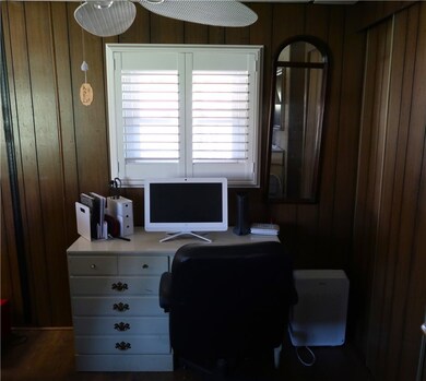 Office nook area in the living room.  Large closet