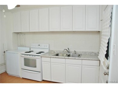 Updated Kitchen with a Tile Backsplash and New Cab