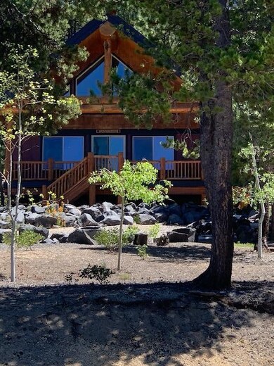 Cabin nestled back from road.