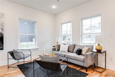 Living room with wood-type flooring